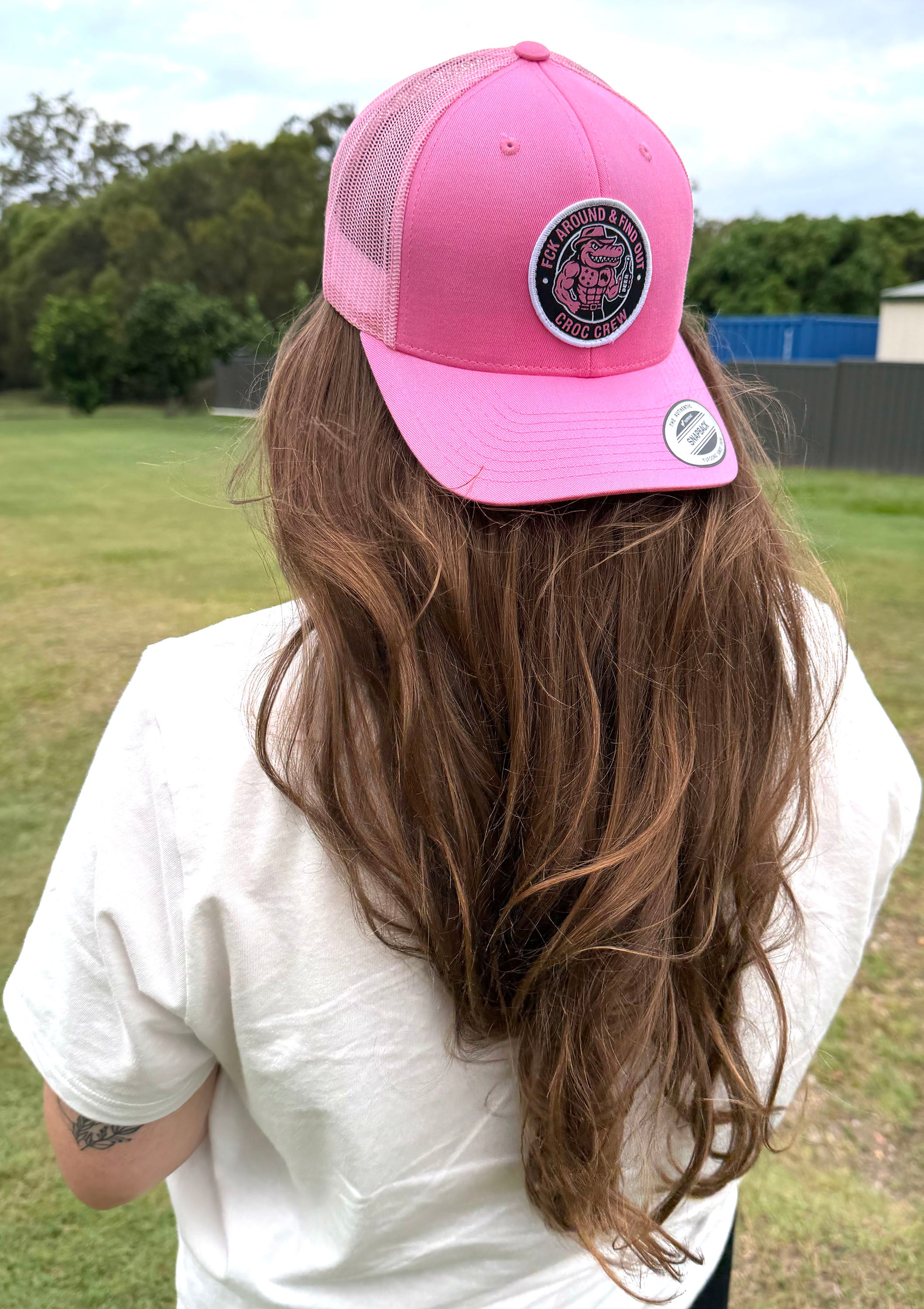 Croc Crew Pink Trucker Cap — Black & White Round FAFO Badge (Yupoong 6606C)