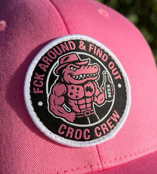 Croc Crew Pink Trucker Cap — Black & White Round FAFO Badge (Yupoong 6606C)